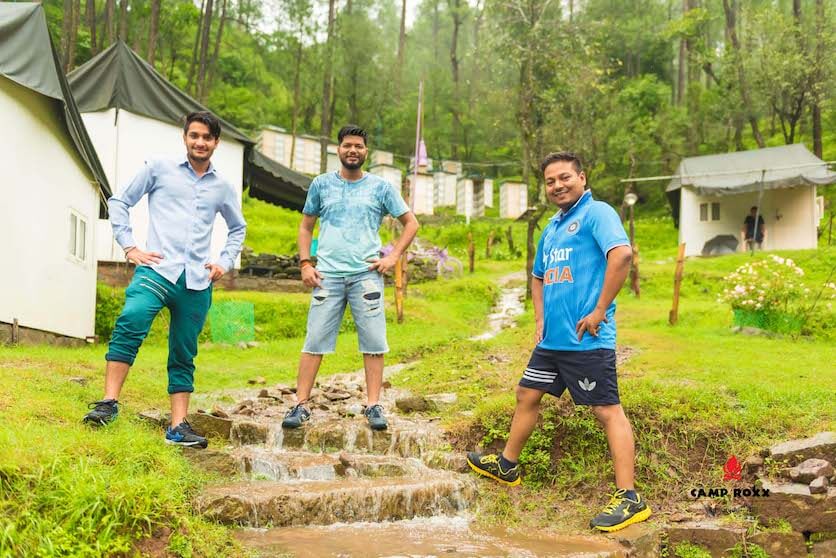 Guests enjoying the campsite stream at Camp Roxx — camping near Delhi